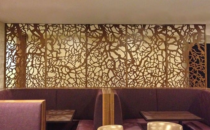 A restaurant with a wall of decorative panels