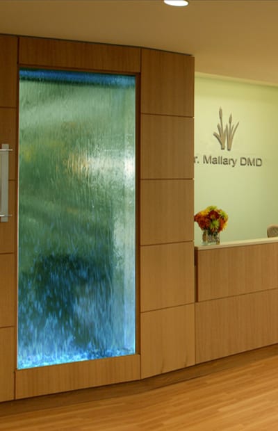 A glass wall in the lobby of a dental office.