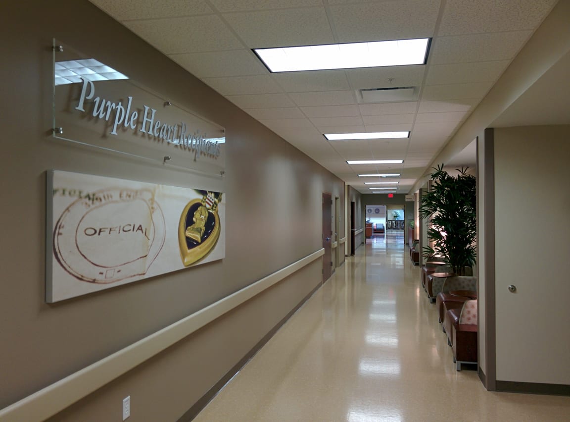 A hallway with a sign on the wall.