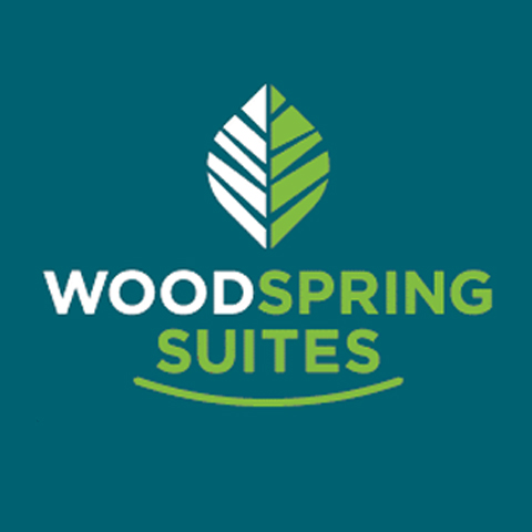 A green and white logo for woodspring suites.