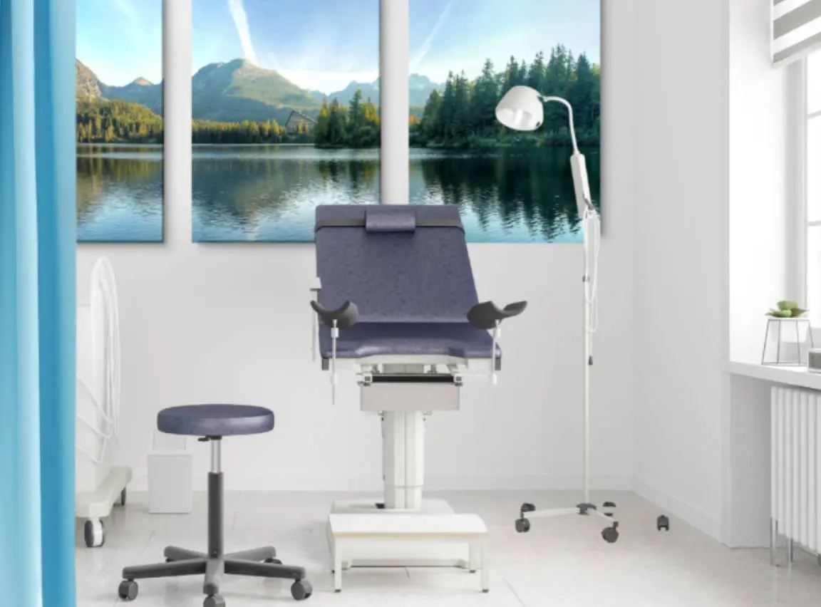 IMG_20140814_090448_lr A modern gynecological examination chair in a bright clinic room.